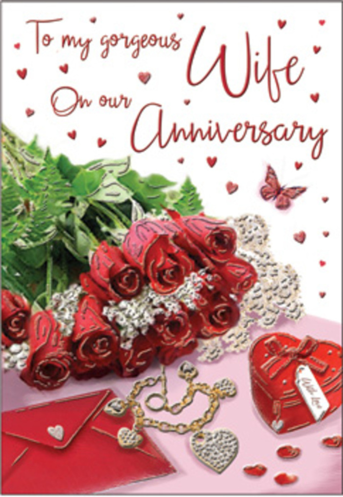 In this richly emotive anniversary card image, a bouquet of classic red roses takes centre stage like a star display in a Gospel Oak florist's window. Each bloom is generously full, with layers of petals unfolding in luscious spirals of deep crimson, their velvety texture almost tangible. These roses are elegantly wrapped and framed by lush green foliage, the leaves glossy and slightly curved, enhancing the sense of natural abundance. Around the flowers, subtle yet meaningful details appear: fine lace-like patterns trace the edges of the card, and small heart motifs are scattered gently, suggesting the quiet layering of memories over time. A jewellery set, perhaps earrings and a delicate necklace, lies nearby with understated sparkle, their metallic tones of gold or silver catching the light in slim, refined lines. A vivid red box, smooth and slightly domed, rests close to the flowers, hinting at a treasured gift chosen with care. The scripted message on the card flows in graceful, looping handwriting, with a few key words visible, enough to convey affection without overwhelming the visual story. Light falls softly from above, casting a warm glow across the petals, the reflective jewellery, and the rich red box, while shadows pool gently beneath, creating depth and intimacy. The scene feels undeniably romantic, much like a quiet stroll around Hampstead Heath with someone special, the city fading into the background. Everything - from the textures of velvet, gold, and silk to the carefully positioned keepsakes - evokes a warm, enveloping embrace, offering a visual tribute as memorable and sincere as the anniversary it honours for couples in Gospel Oak.