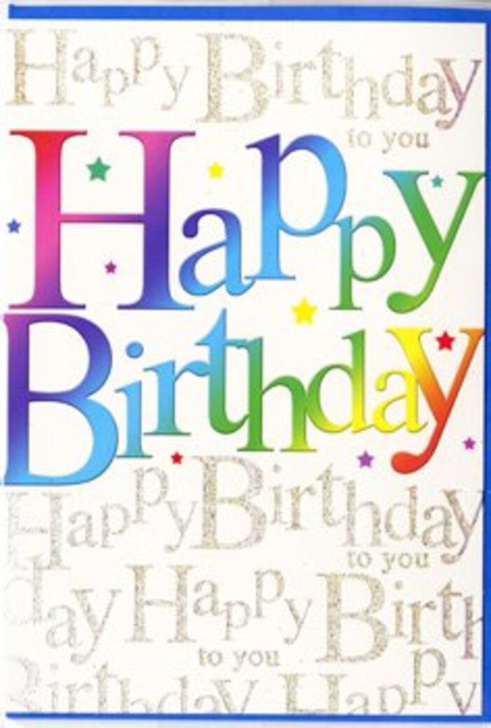 The photograph shows a birthday card that feels instantly celebratory, as if it has captured the joyful mood of a family party in Gospel Oak. Dominating the front is the greeting 'Happy Birthday', written in generously sized, gently curved letters that stretch confidently across the card. Each letter carries its own colour, forming a seamless gradient that moves through the full spectrum-from juicy reds and rosy pinks into regal violets, cobalt and aqua blues, cool mint, bright grass green, and mellow sunshine yellow. The overall impression is that of a rainbow gently brushed across the card, similar to the blend of colours you might see across the skies above Hampstead Heath after a light shower. Behind this main phrase, the background is filled with fine, looping gold script that repeats the words 'Happy Birthday to you' in delicate, almost musical lines. The elegant handwriting flows horizontally in soft bands, giving a sense of rhythm, as if the card itself is humming the familiar birthday tune. The gold ink sparkles subtly, catching the light in tiny points that resemble scattered confetti or the reflections off glassware laid out for a birthday toast on a table near Parliament Hill. The card surface appears smooth and refined, likely with a satin or silk-like finish that feels luxurious but not overly glossy. The design is clean and uncluttered, with no added illustrations, allowing the interplay of bold colour and shimmering text to set the tone. It conveys warmth, happiness, and a touch of sophistication-perfect for accompanying a bouquet from Gospel Oak Flowers to make a special birthday feel thoughtfully marked.