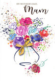 The illustration on this Mother's Day card presents an uplifting, watercolour bouquet that seems to glow with the relaxed, artistic charm of Gospel Oak. At its heart, generous blooms in cerise, magenta, and soft rose overlap, painted with broad, fluid strokes that give the impression of petals unfurling in slow motion. Deep indigo and inky blue outlines tuck into the folds of the flowers and define their outer edges, creating a rich contrast that lets the pinks and reds stand out vividly. Among these central blossoms, gentle touches of lavender, cool blue, and pale apricot soften the transitions, suggesting smaller supporting flowers nestled within the bouquet. Subtle hints of fresh green and chartreuse weave in between, alluding to discreet leaves and stems that provide structure. Fine gold lines and small gilded accents skim along the petals and leaves, catching the eye like sunlight reflecting off fresh water droplets on flowers displayed near Gospel Oak station. This warm metallic shimmer reappears in the delicate bow that cinches a rounded vase, painted in soft layers of blue, lilac, and muted grey that give it a slightly translucent, glass-like feel. Surrounding the arrangement, tiny heart motifs and scattered paint splashes drift outward across the white background, like petals tossed in celebration at a family picnic on Hampstead Heath. The composition feels airy yet grounded, full of joy yet also deeply tender, perfectly capturing the gratitude, admiration, and quiet reassurance many wish to express on Mother's Day. Created with an artist's hand and a florist's eye, it speaks gently of love to mums throughout Gospel Oak.